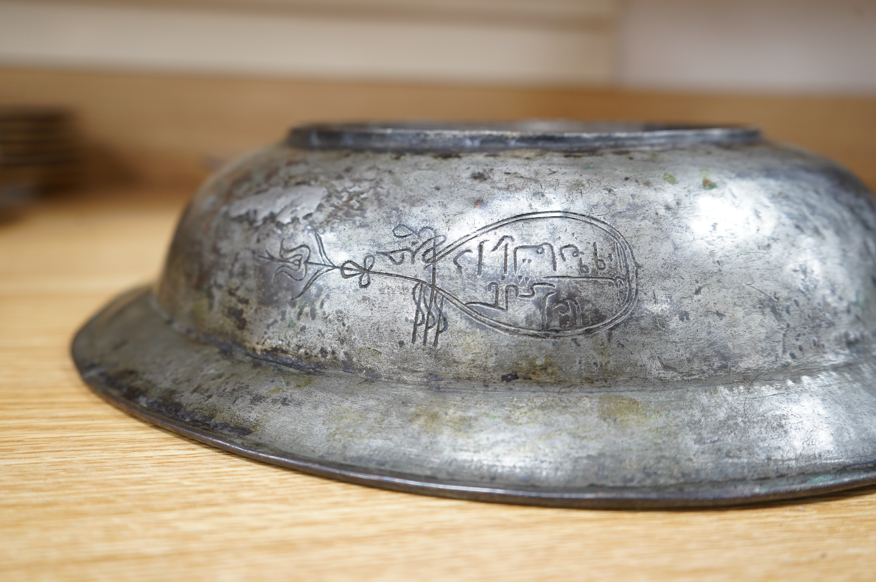 A Safavid tinned copper bowl engraved with a goat and flowers, 32cm diameter. Condition - fair